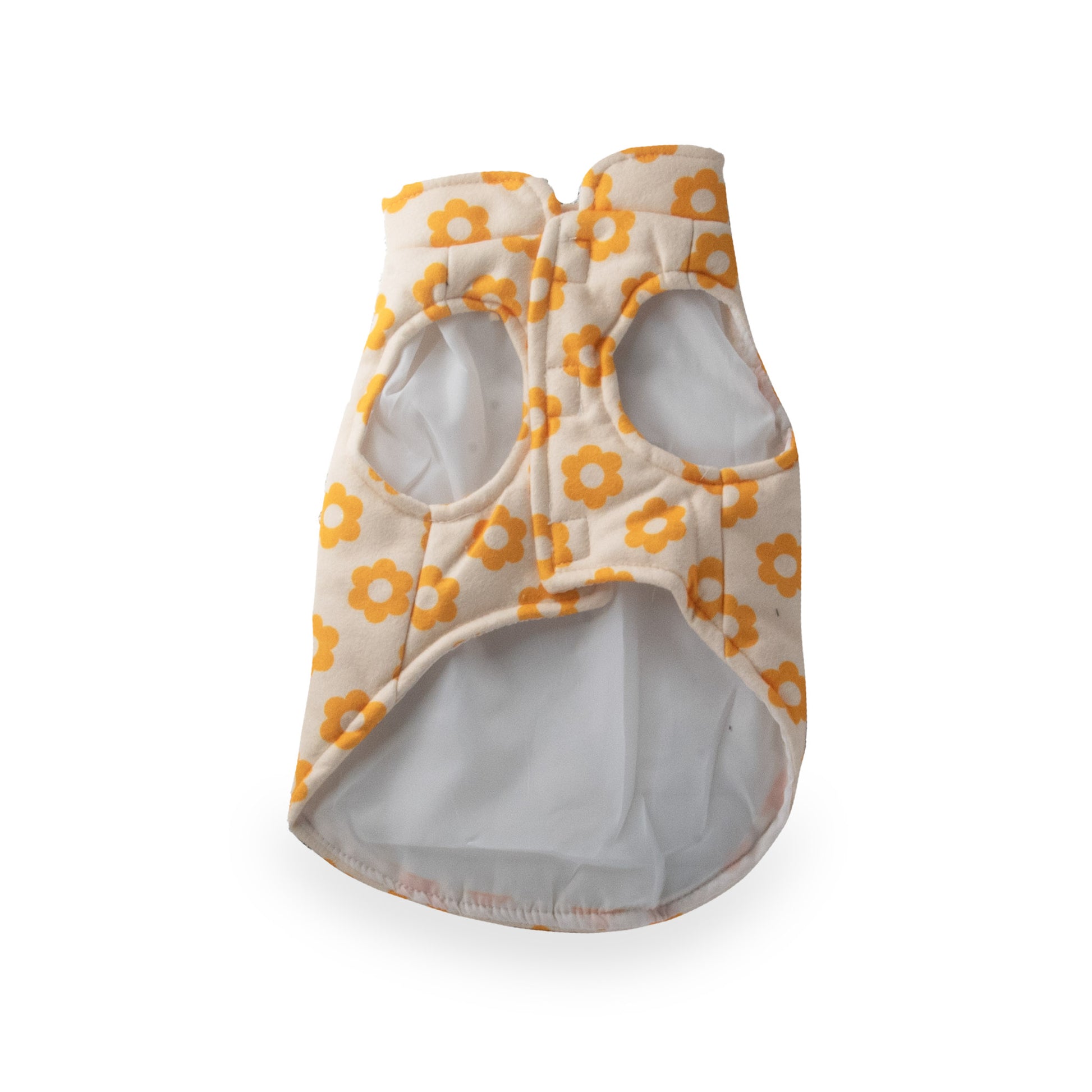 image shows an Axel Roze Pets Flower Power Fleece Coat, coat is cream-colored with an orange floral pattern and has openings for the animal's front legs