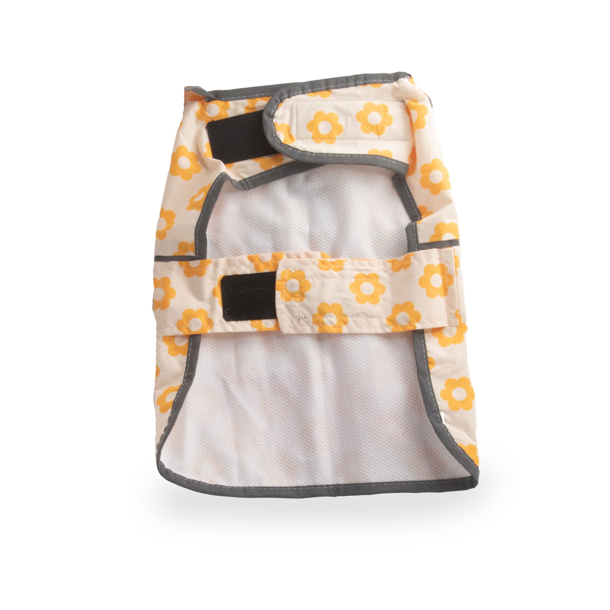 image shows a washable dog diaper. It is white with a pattern of yellow flowers and has velcro closures